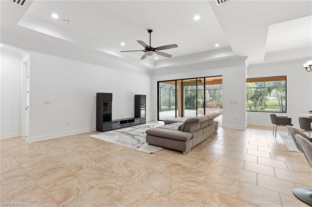1584 Mockingbird Drive Naples, FL 34120 - Photo 17 of 40 a living room with furniture and large windows