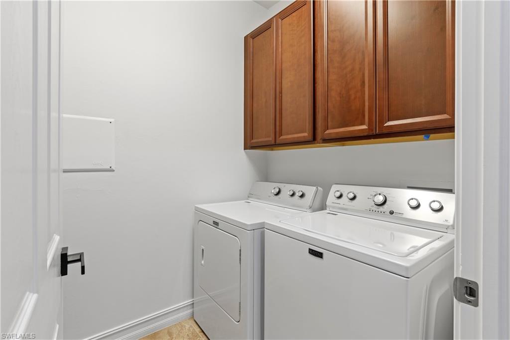 1584 Mockingbird Drive Naples, FL 34120 - Photo 24 of 40 a utility room with dryer and washer