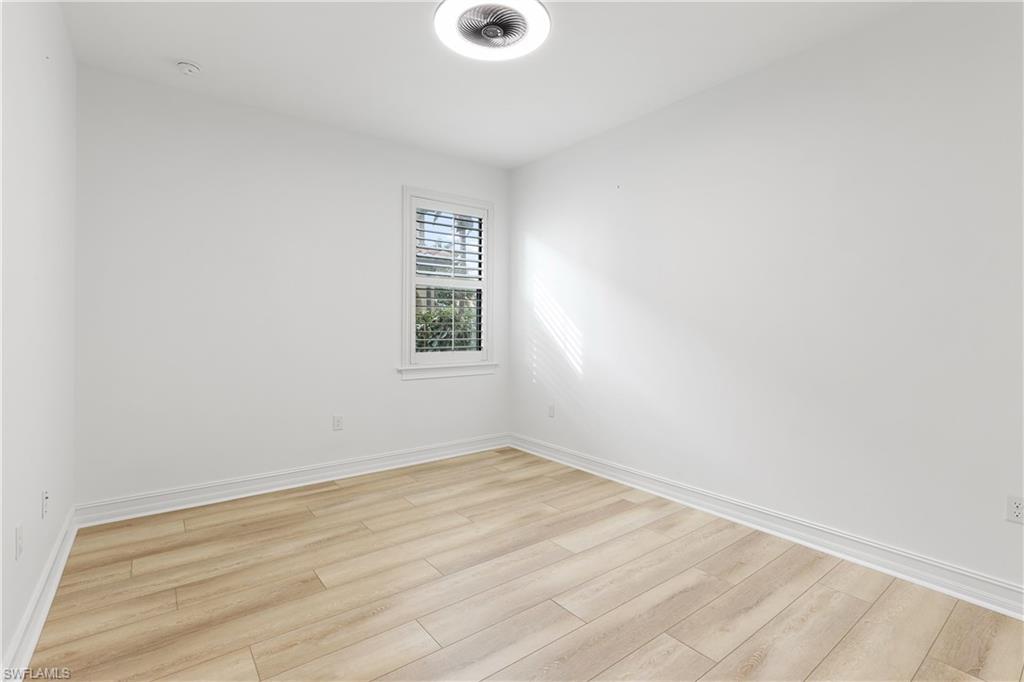 1584 Mockingbird Drive Naples, FL 34120 - Photo 25 of 40 an empty room with a window