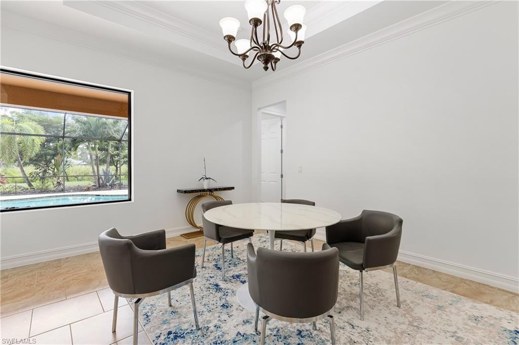 1584 Mockingbird Drive Naples, FL 34120 - Photo 29 of 40 a dining room with furniture and window