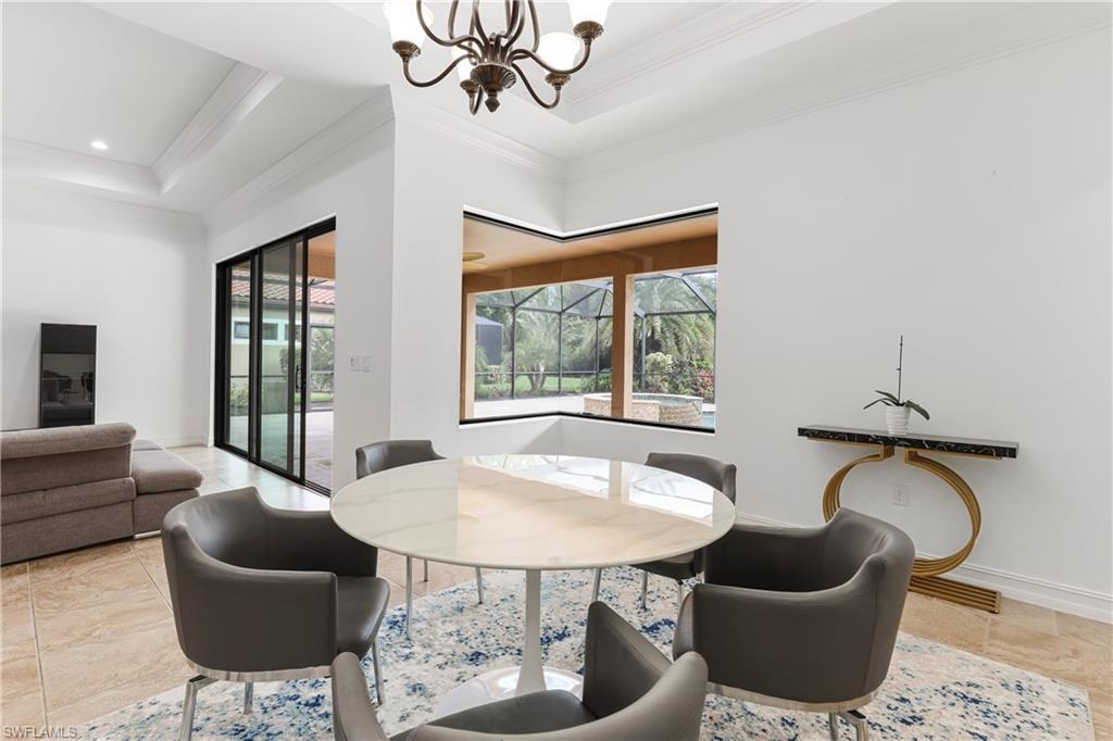 1584 Mockingbird Drive Naples, FL 34120 - Photo 30 of 40 a living room with furniture and a window