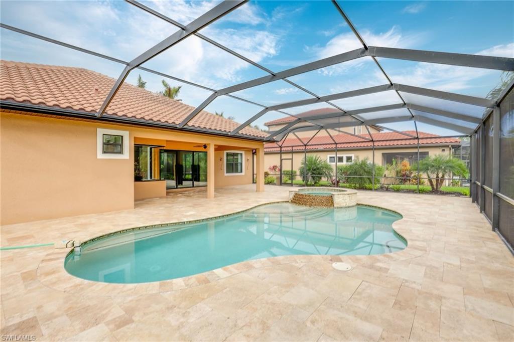 1584 Mockingbird Drive Naples, FL 34120 - Photo 35 of 40 a view of a swimming pool with a patio