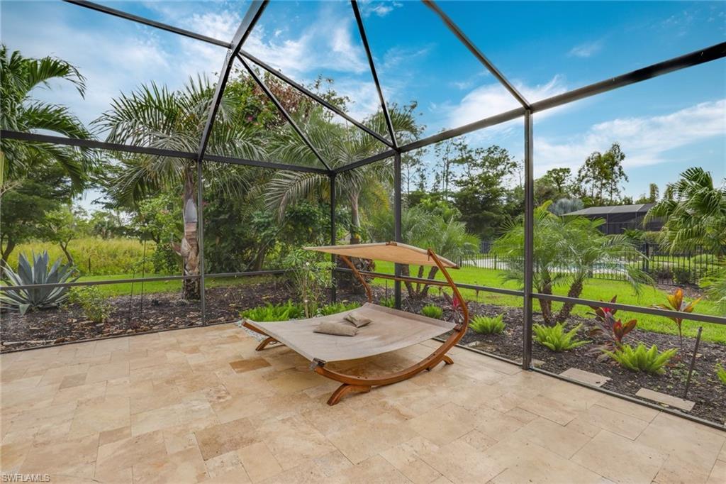 1584 Mockingbird Drive Naples, FL 34120 - Photo 37 of 40 a garden view with a seating space