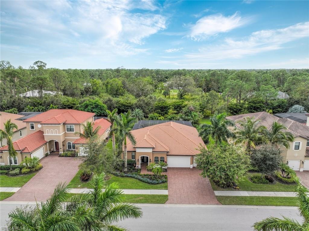 1584 Mockingbird Drive Naples, FL 34120 - Photo 4 of 40 an aerial view of a house with big yard