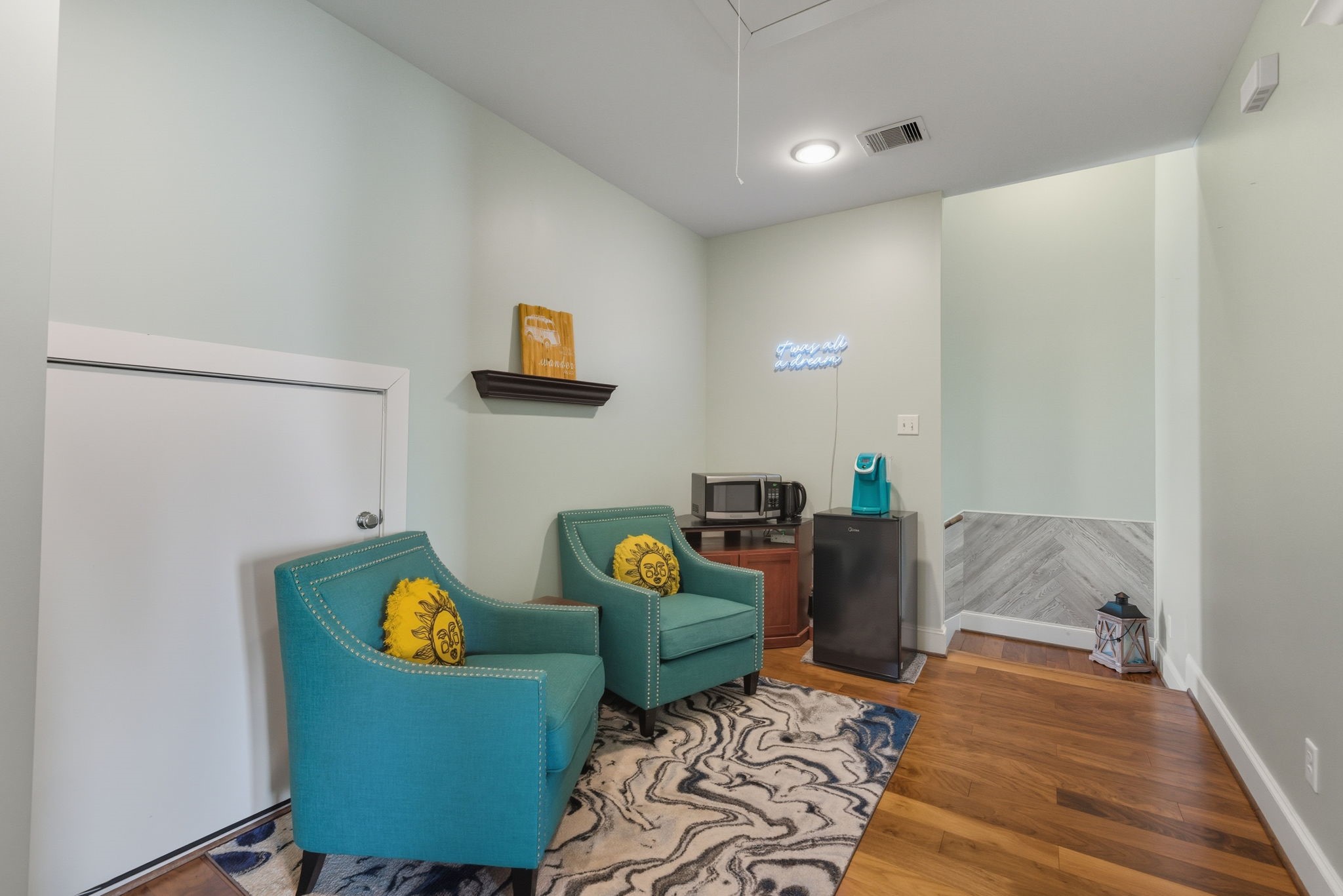 2011 Crockett Street Houston, TX 77007 - Photo 20 of 26 FLEX AREA upstairs - office, workout space, second living room - many possibilities! This area was the living space for the AirBnB. A little additional storage space - door behind the chair