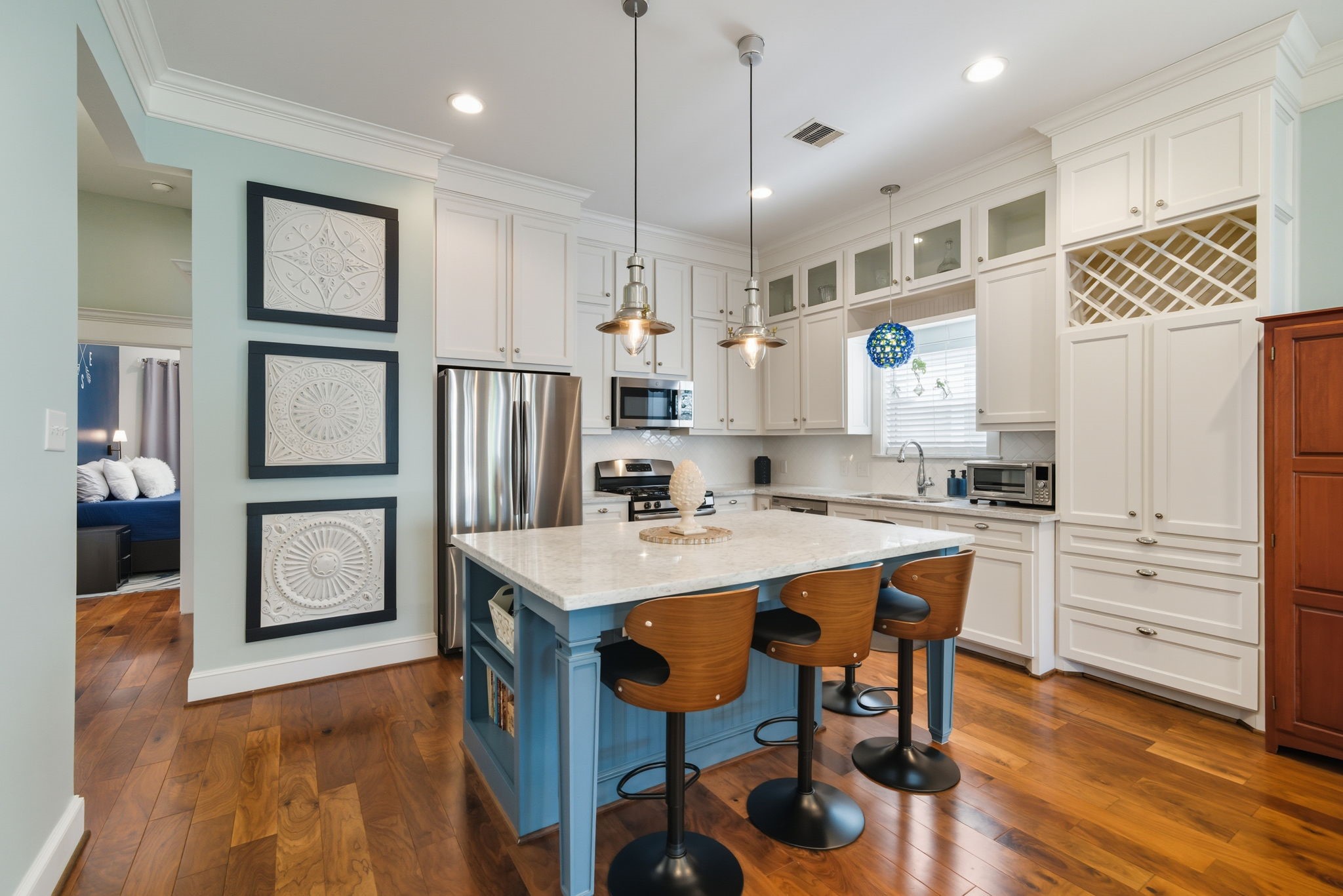 2011 Crockett Street Houston, TX 77007 - Photo 10 of 26 White cabinets built to the ceiling - STORAGE! Stainless steel appliances (fridge will convey), gas stove, marble counters + large island (seats 4)