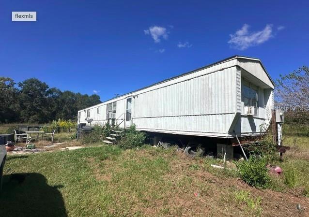 565 Southwest Daisy Road Lake City, FL 32024 - Photo 1 of 15 a backyard of a house with lots of green space