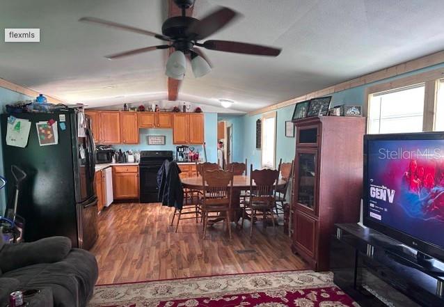 565 Southwest Daisy Road Lake City, FL 32024 - Photo 14 of 15 a dining room with furniture a rug a chandelier and wooden floor