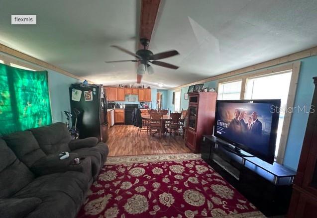 565 Southwest Daisy Road Lake City, FL 32024 - Photo 15 of 15 a living room with furniture and a flat screen tv
