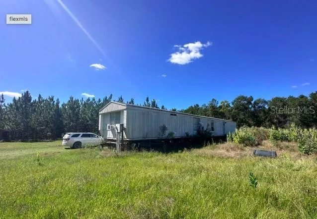 a view of a backyard with a house