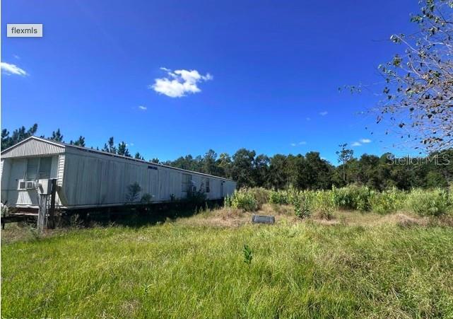 565 Southwest Daisy Road Lake City, FL 32024 - Photo 3 of 15 a view of a yard with a house