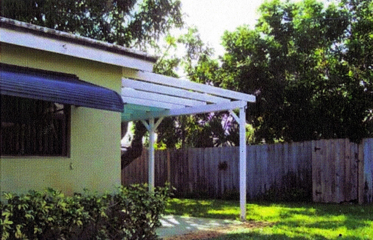 2145 Northeast 4th Way Boca Raton, FL 33431 - Photo 10 of 41 Fenced Back Yard w/Trellis Covered Patio