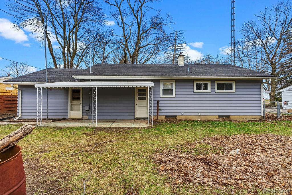 3485 Hammerberg Road Flint, MI 48507 - Photo 33 of 35 Back of property featuring a chimney and crawl space