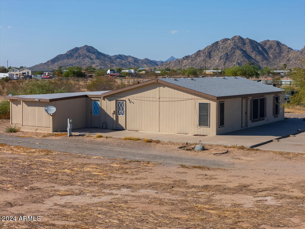 8926 North Thunderbird Road Maricopa, AZ 85139 - Photo 12 of 49 a view of a house with a outdoor space