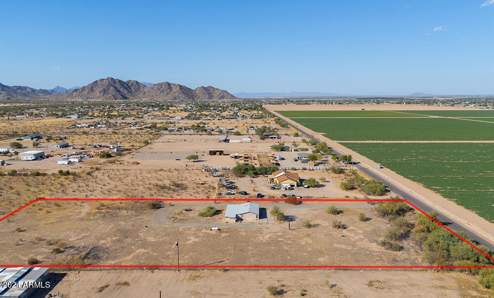 8926 North Thunderbird Road Maricopa, AZ 85139 - Photo 19 of 49 a view of a large body of water with a building in the background