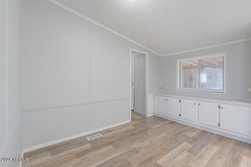 8926 North Thunderbird Road Maricopa, AZ 85139 - Photo 29 of 49 wooden floor in an empty room