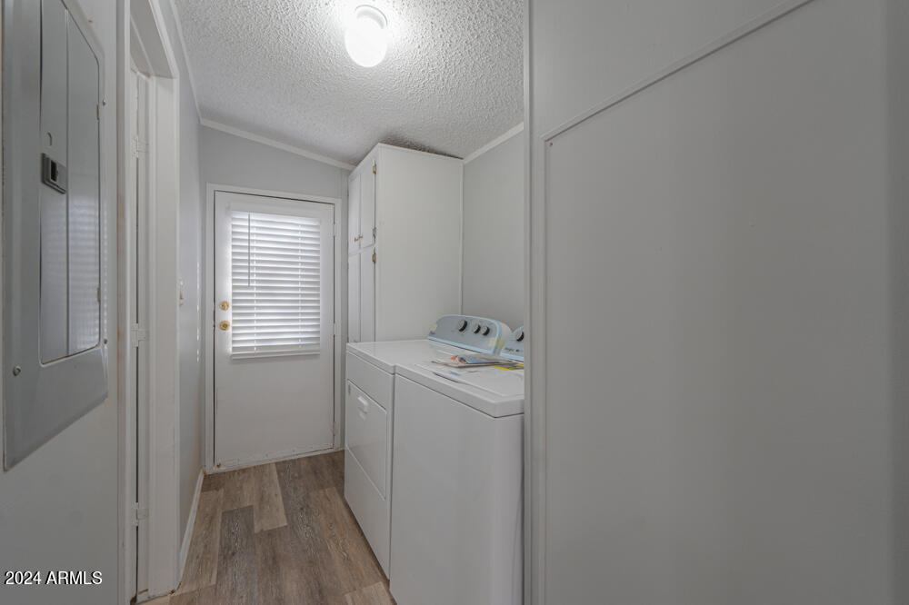 8926 North Thunderbird Road Maricopa, AZ 85139 - Photo 35 of 49 a utility room with dryer and washer