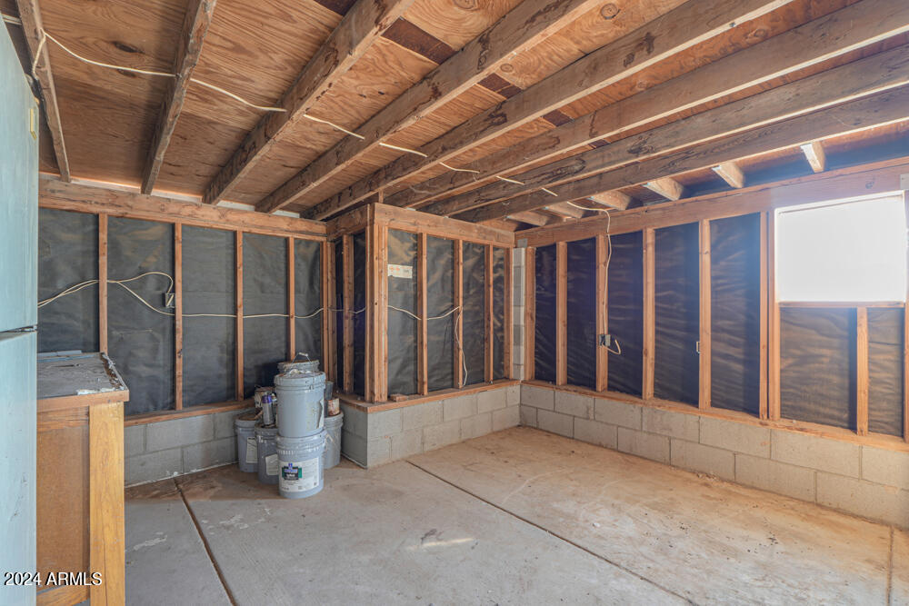 8926 North Thunderbird Road Maricopa, AZ 85139 - Photo 49 of 49 a view of an empty room with wooden floor and fence