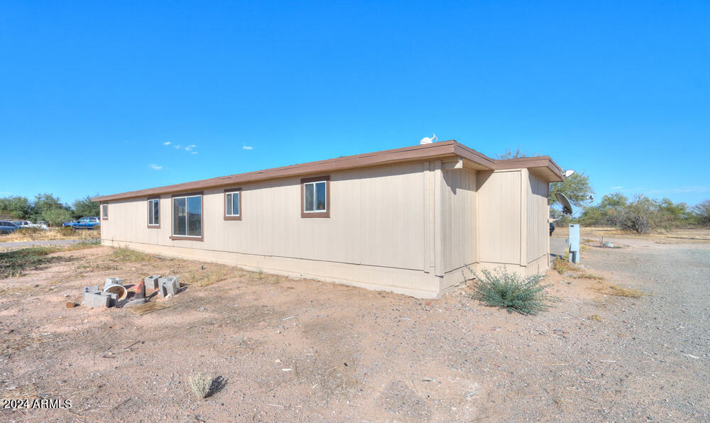 8926 North Thunderbird Road Maricopa, AZ 85139 - Photo 5 of 49 a view of a house with a yard