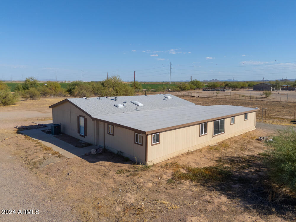 8926 North Thunderbird Road Maricopa, AZ 85139 - Photo 9 of 49 a aerial view of a house with a yard