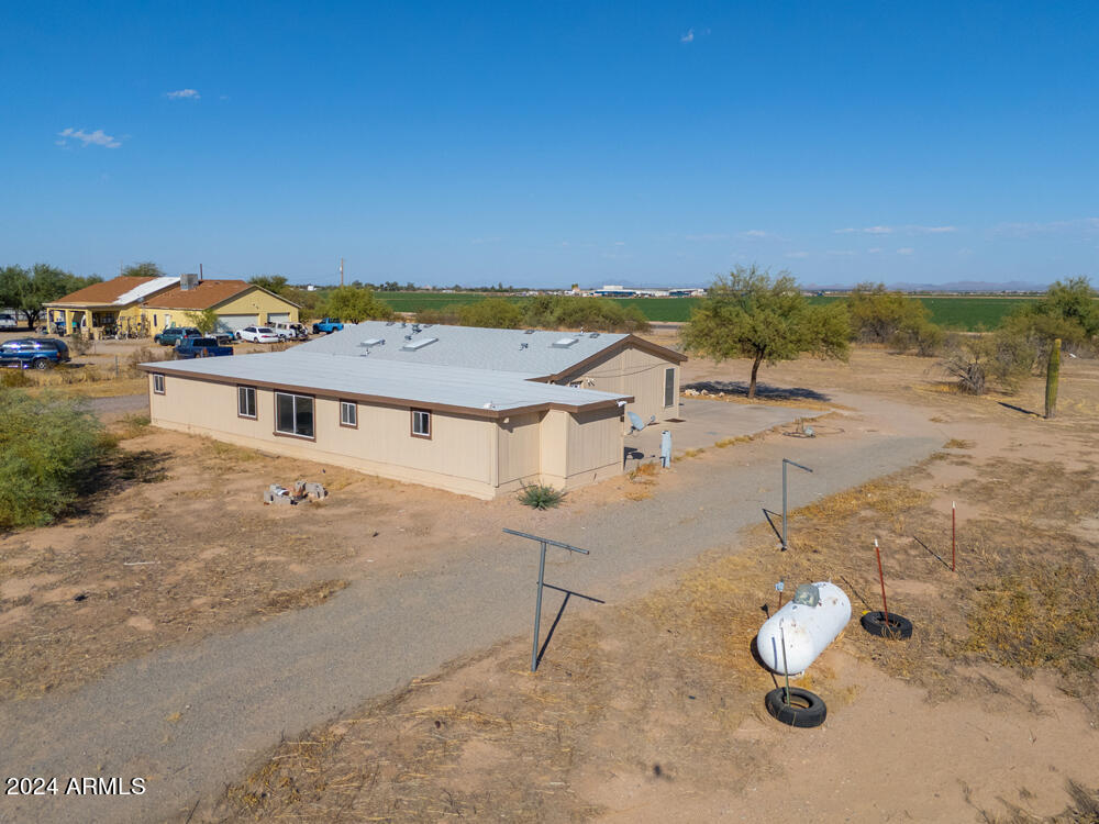 8926 North Thunderbird Road Maricopa, AZ 85139 - Photo 10 of 49 a view of a house with a yard