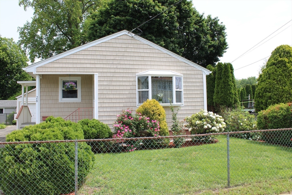 28 State Street Chicopee, MA 01013 - Photo 3 of 25 a front view of house with a garden