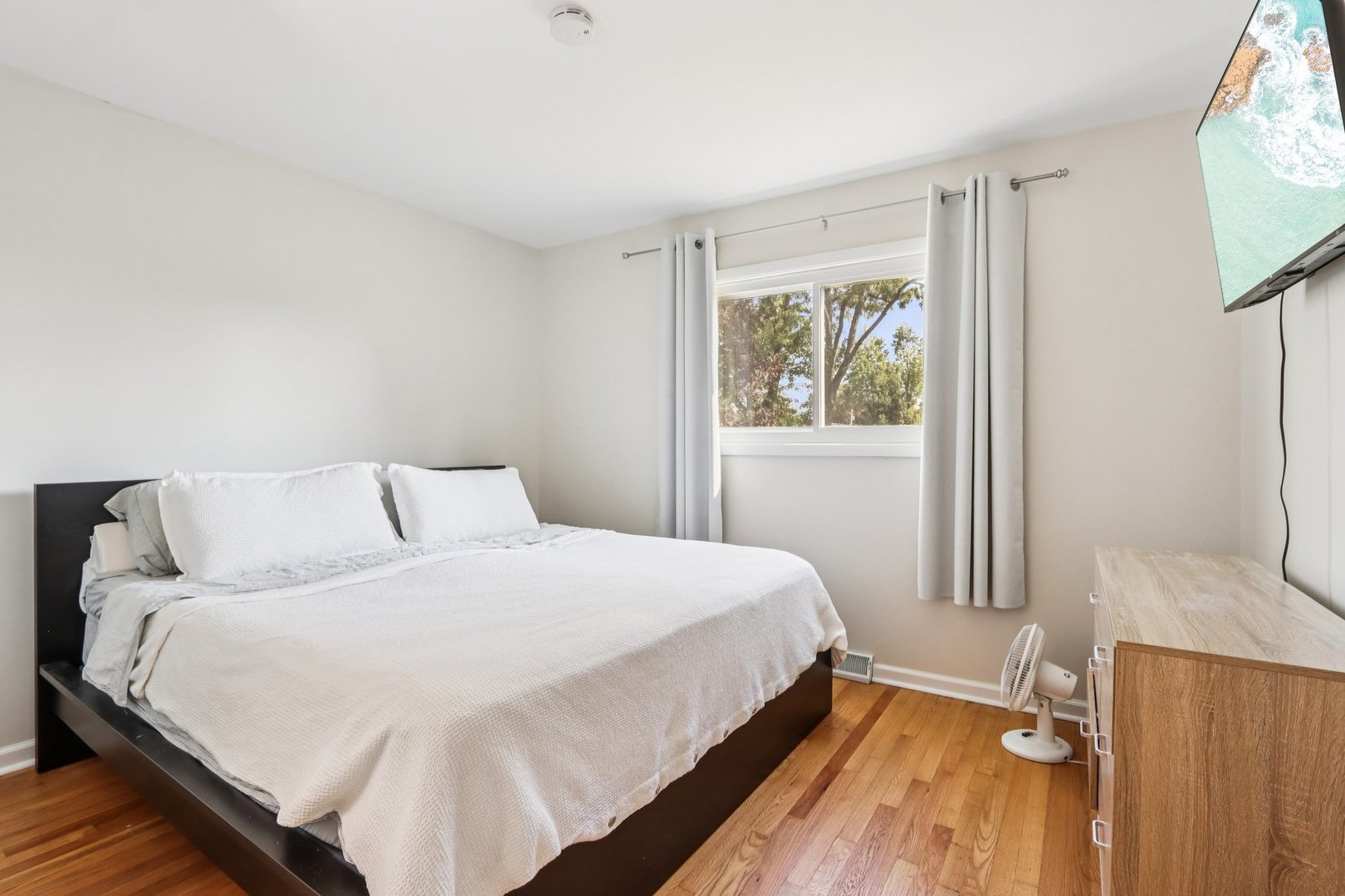 461 Ardmore Terrace Addison, IL 60101 - Photo 11 of 29 a bedroom with a bed and a flat screen tv