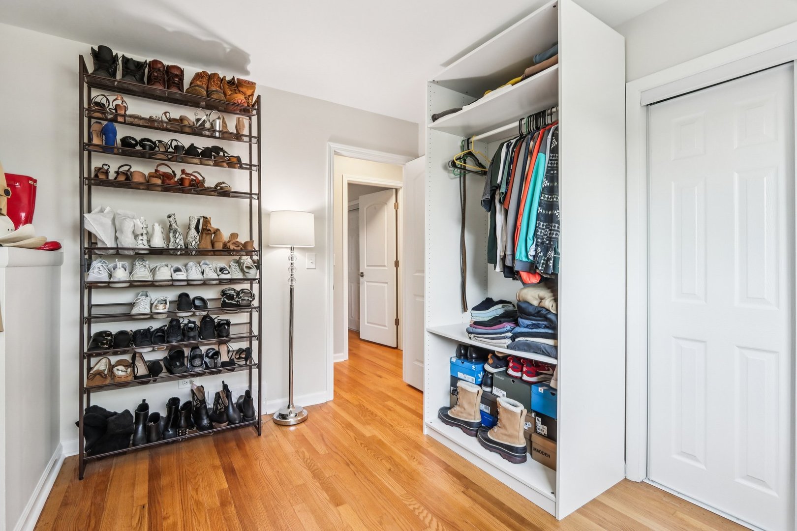 461 Ardmore Terrace Addison, IL 60101 - Photo 18 of 29 a view of walk in closet with clothes and shoes