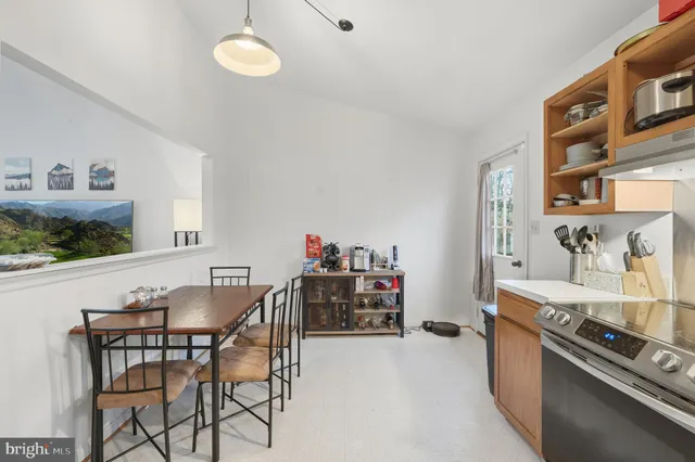 a dining room with furniture and window