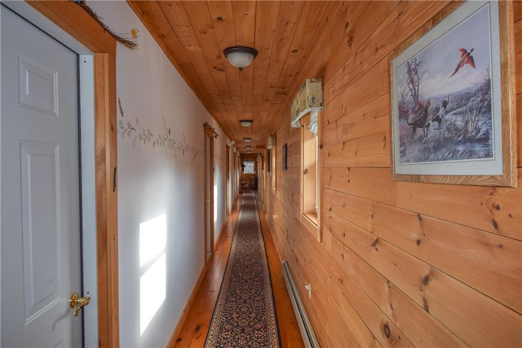 233 Bennett Pond Road Parkman, ME 04443 - Photo 17 of 35 Hallway leading to the five rooms...
