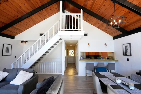 a living room with furniture ceiling fan and a rug