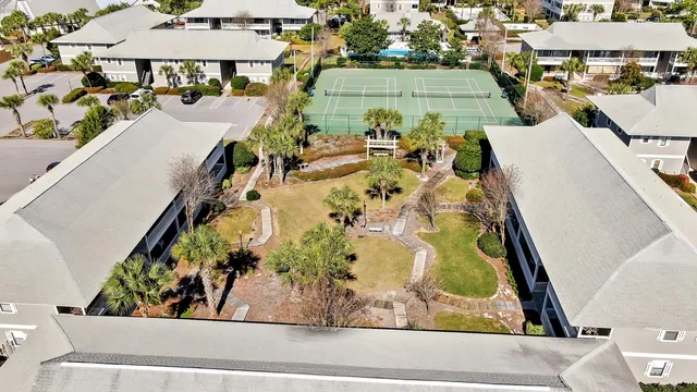 an aerial view of residential houses with outdoor space