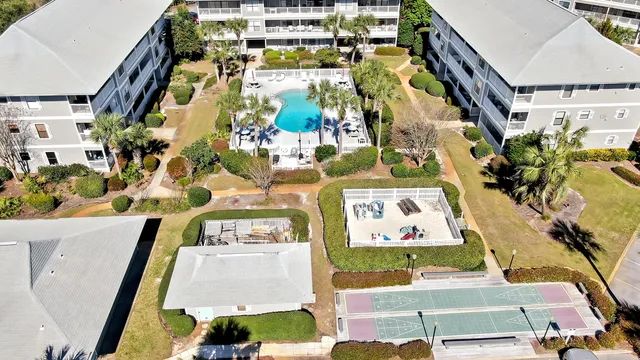 an aerial view of a building with an outdoor space