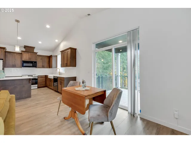a dining room with furniture and a window