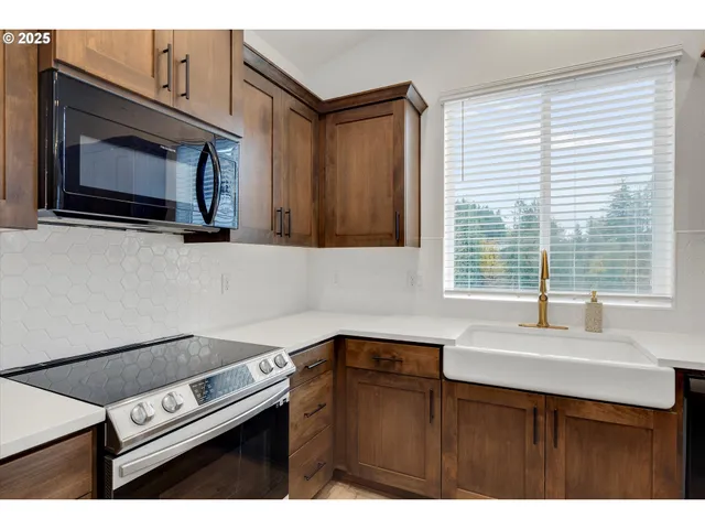 a kitchen with a cabinets and a sink