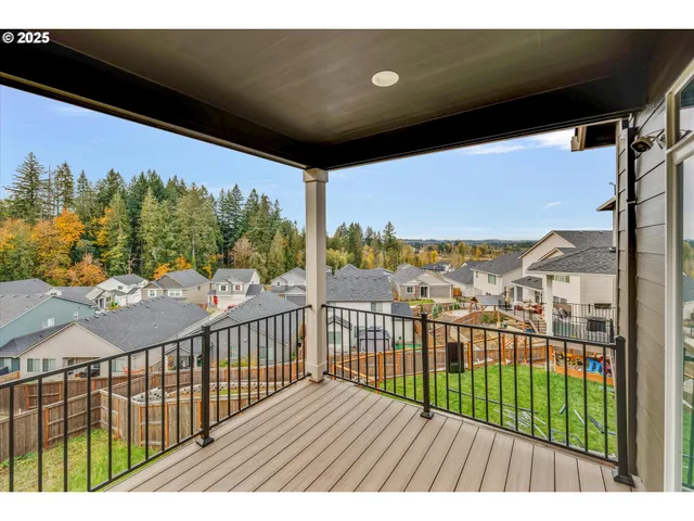 a view of a balcony with wooden floor