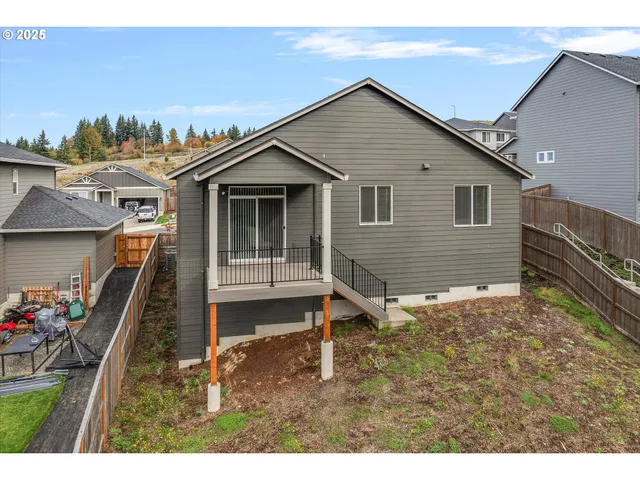 a backyard of a house with lots of green space