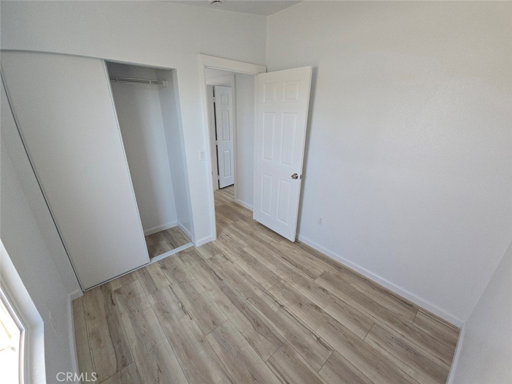 13096 Blackbird Street, Unit 164 Garden Grove, CA 92843 - Photo 13 of 19 a view of hallway with wooden floor