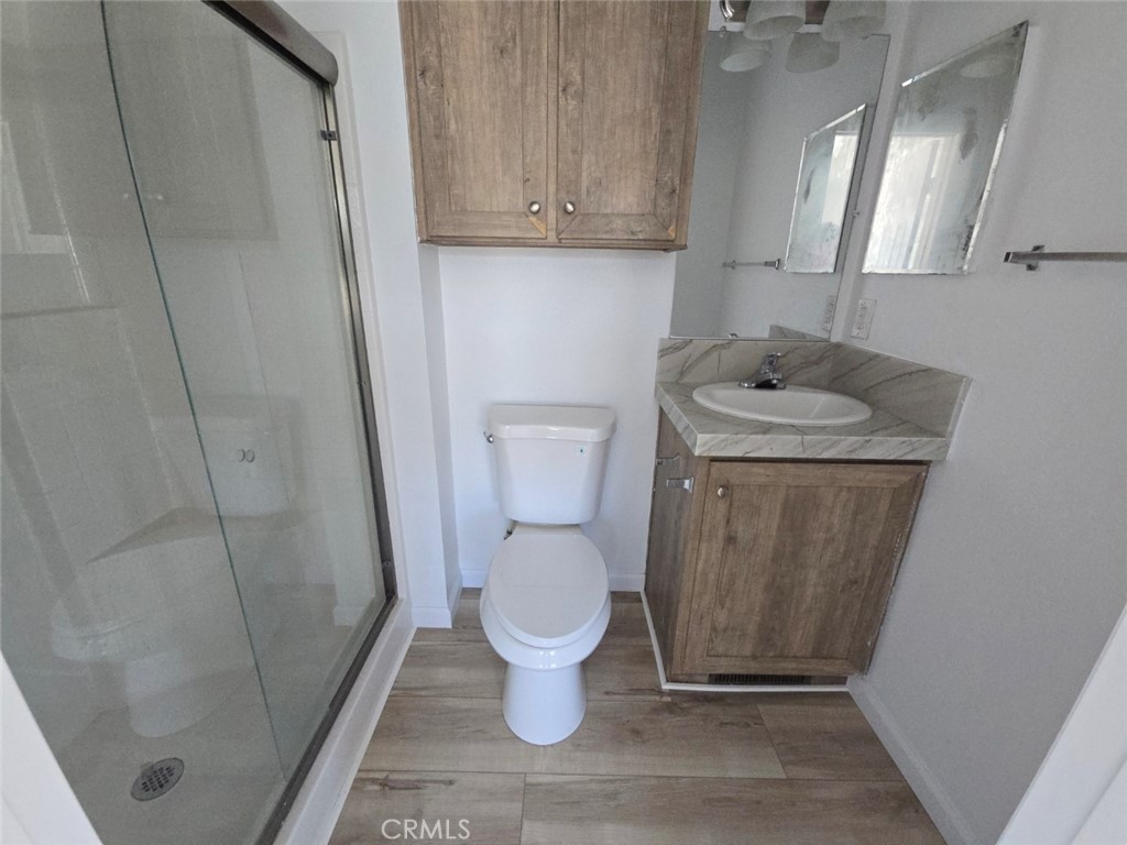 13096 Blackbird Street, Unit 164 Garden Grove, CA 92843 - Photo 14 of 19 a bathroom with a sink and toilet