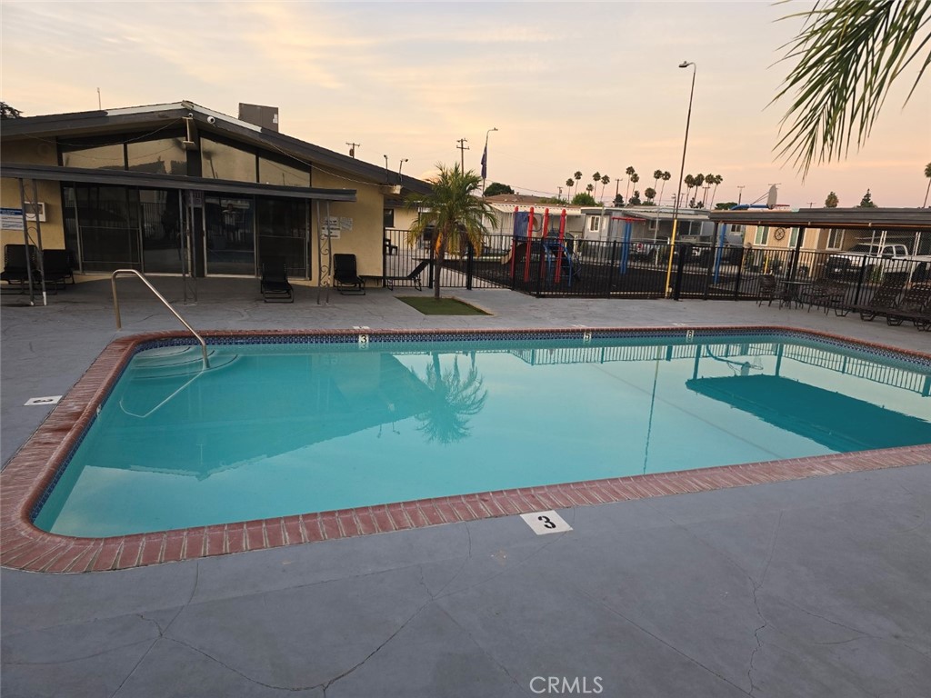 13096 Blackbird Street, Unit 164 Garden Grove, CA 92843 - Photo 18 of 19 an outdoor space with pool and furniture