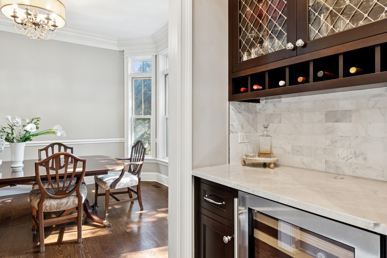 203 South Columbia Street Naperville, IL 60540 - Photo 11 of 59 a kitchen with stainless steel appliances a dining table chairs and stove