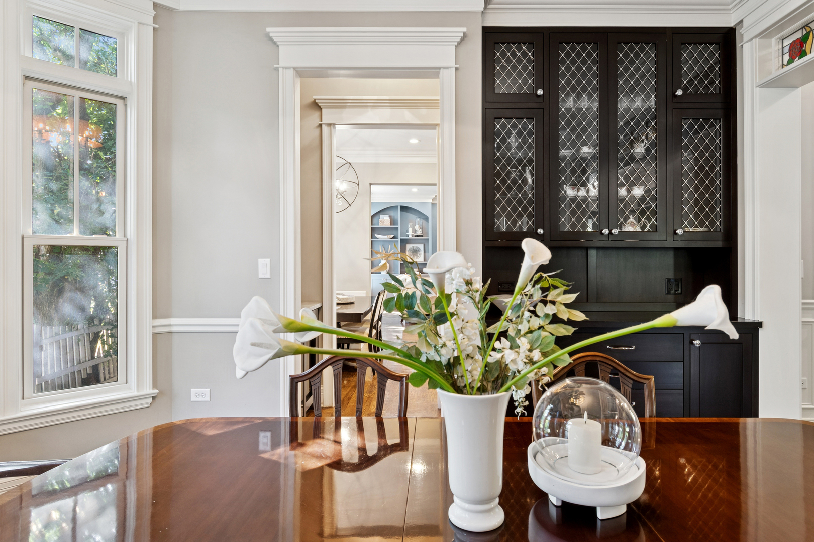 203 South Columbia Street Naperville, IL 60540 - Photo 21 of 59 a dining room with furniture potted plants and wooden floor