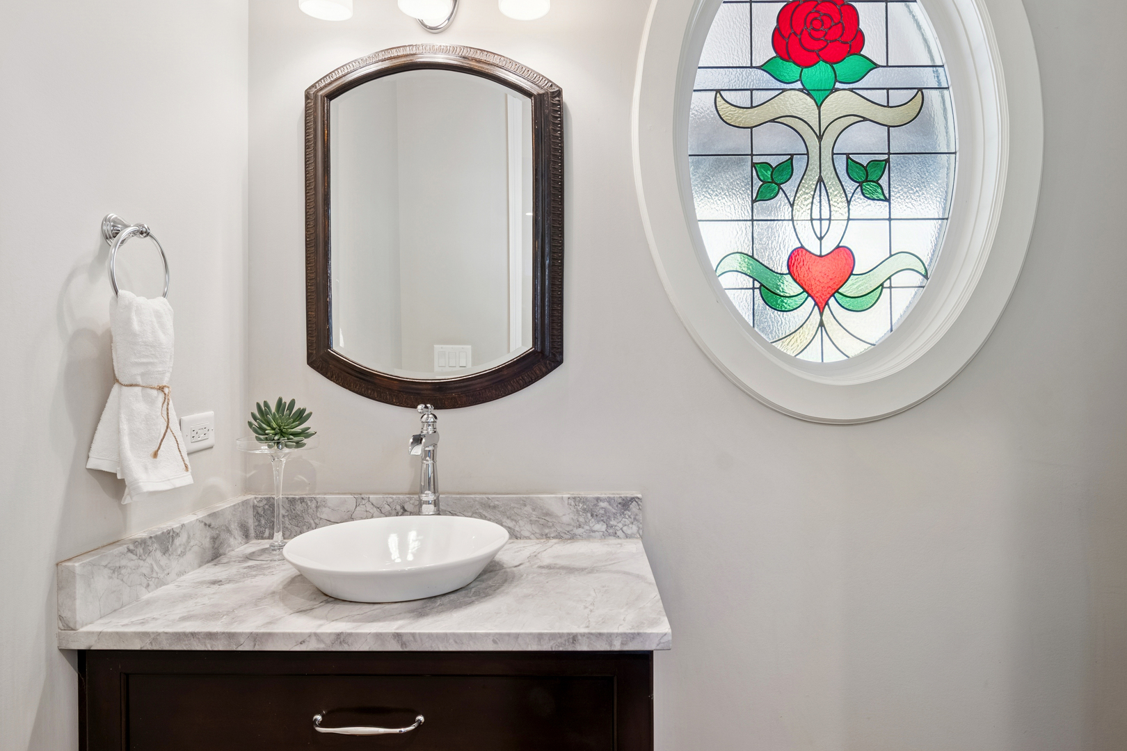 203 South Columbia Street Naperville, IL 60540 - Photo 24 of 59 a bathroom with a sink and a mirror