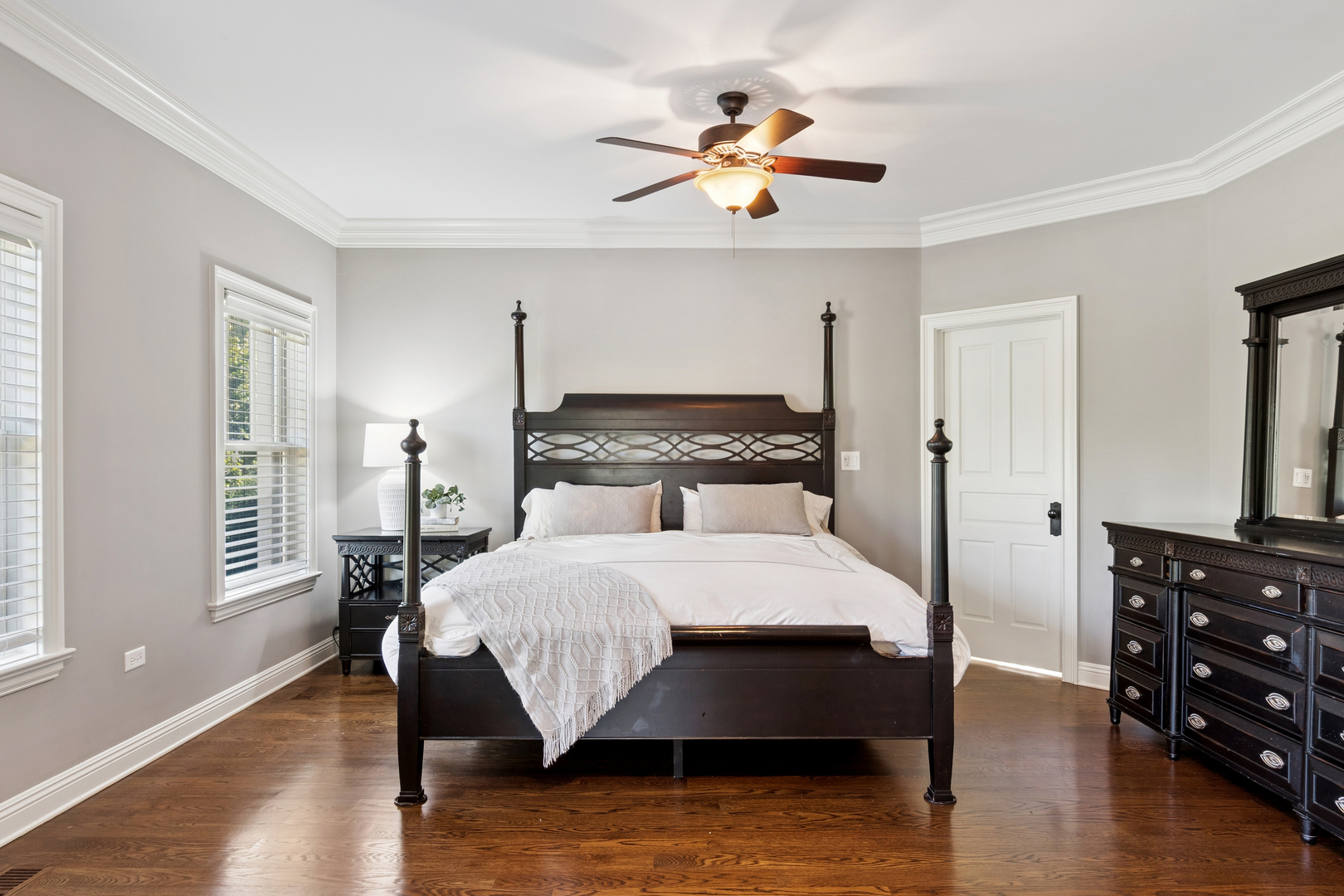 203 South Columbia Street Naperville, IL 60540 - Photo 26 of 59 a bedroom with a bed and dresser with wooden floor