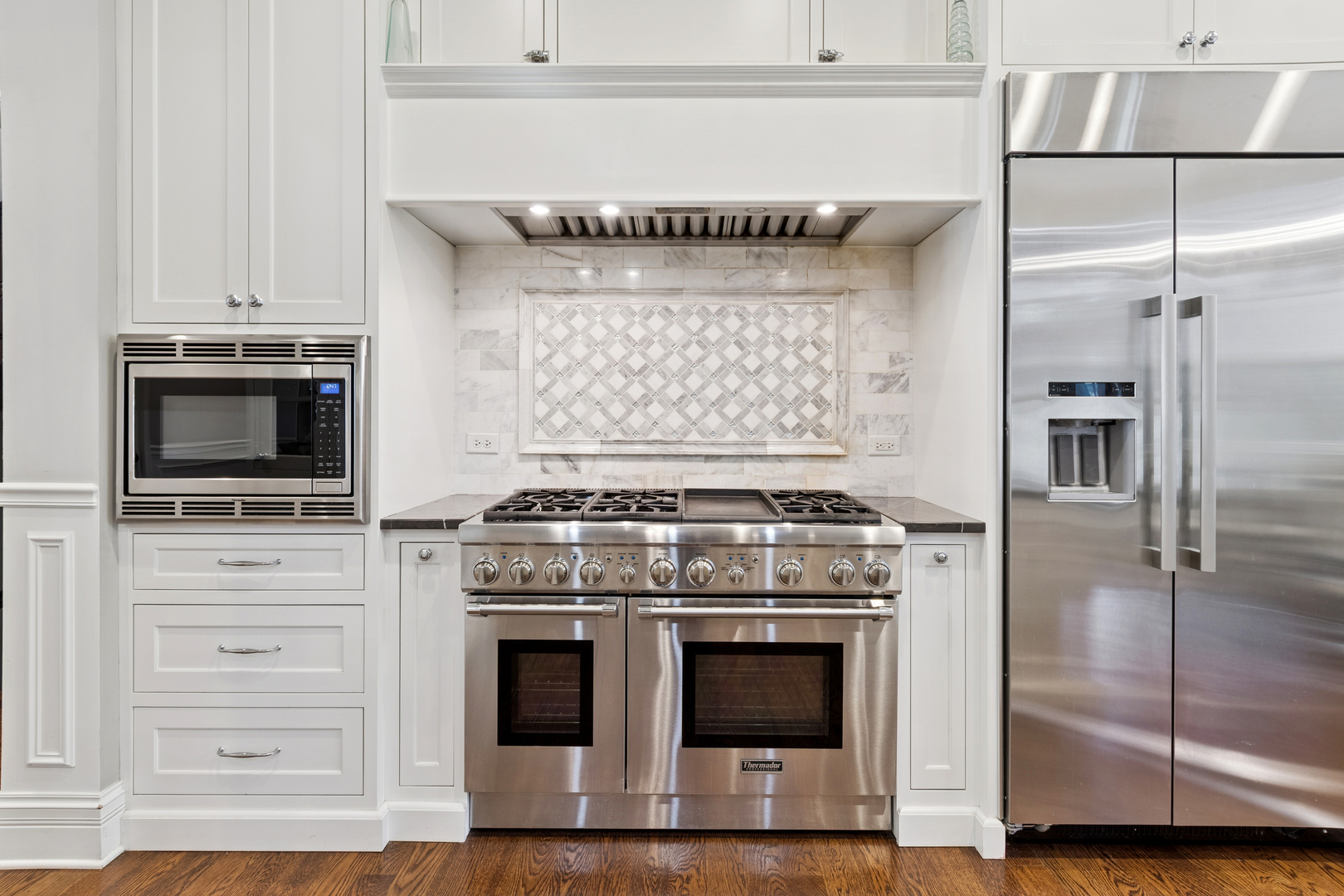 203 South Columbia Street Naperville, IL 60540 - Photo 6 of 59 a kitchen with a stove and a microwave