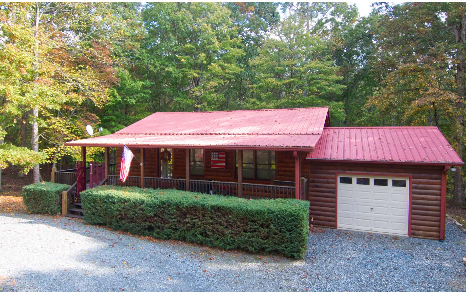 412 Songbird Avenue Blue Ridge, GA 30513 - Photo 1 of 1 a front view of a house with a garden