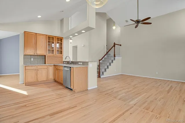 a view of kitchen with cabinets and wooden floor