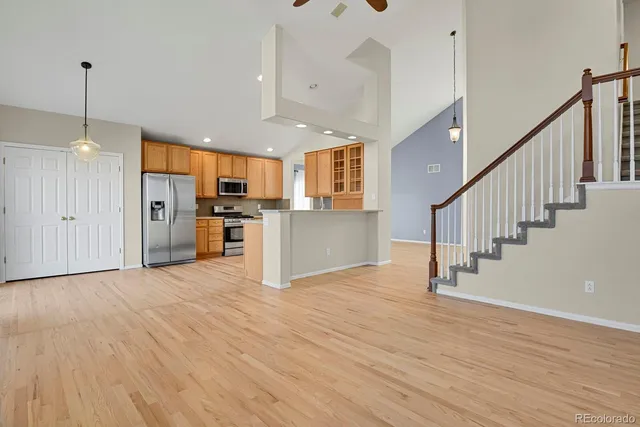 a view of kitchen with stainless steel appliances refrigerator oven and stove