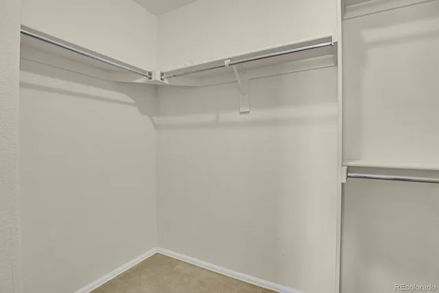 a view of an empty walk in closet