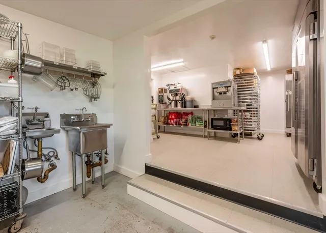 a kitchen with a table and chairs